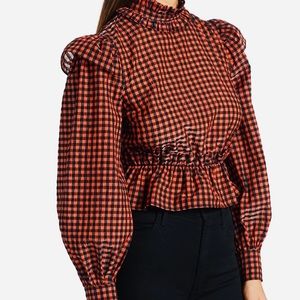 Victorian-inspired ruffle neck blouse with matching ruffles at the shoulder.